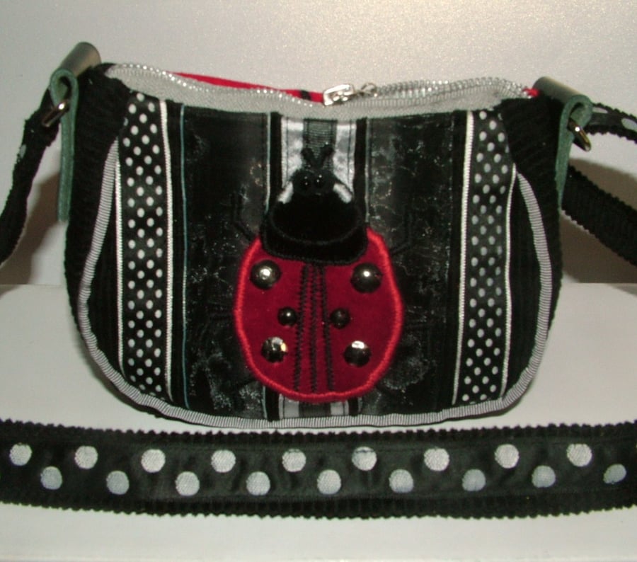Black, White and silver  Ladybird purse with long adjustable strap
