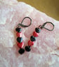 Red & Black Hematirte Gemstone Heart Dangle Earrings - Image 1