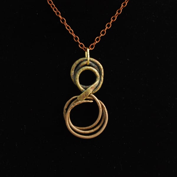 Beach metal swirling shapes pendant