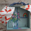 Hope window wall hanging with bright orange print 
