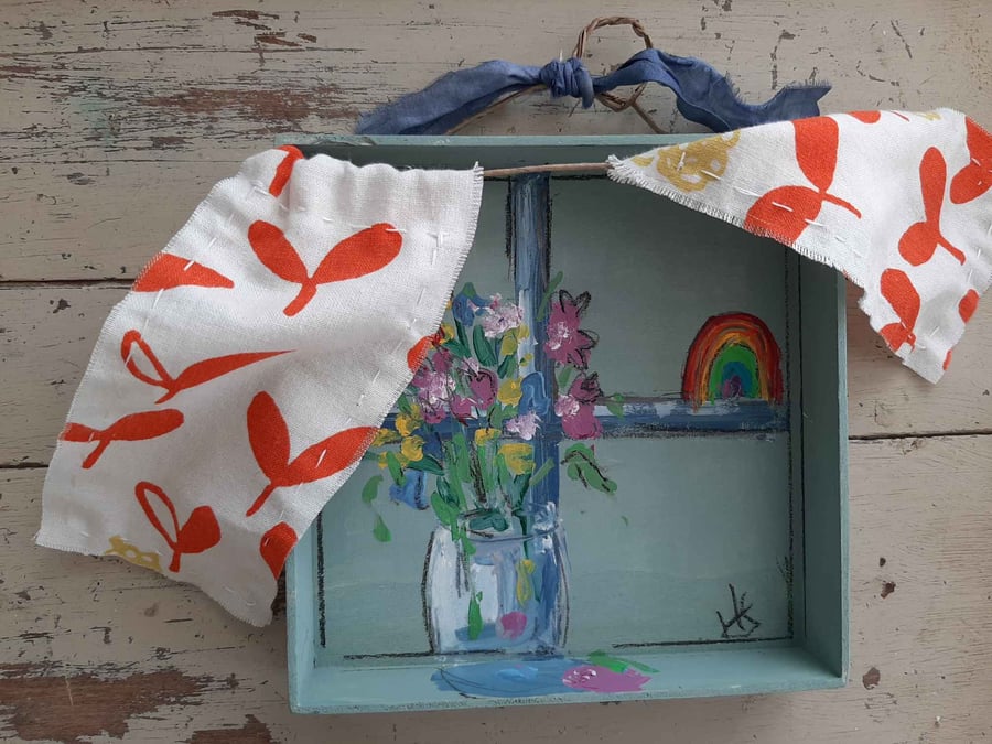 Hope window wall hanging with bright orange print 