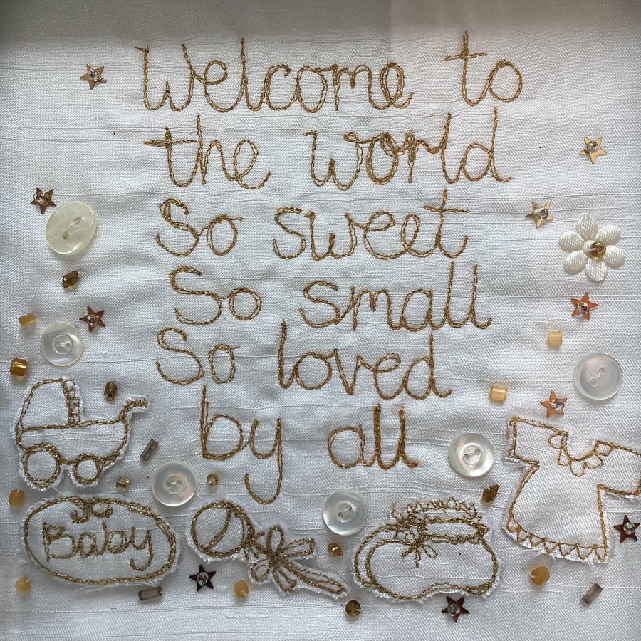 Welcome to the world embroidered baby picture.