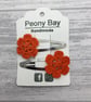 Orange flower hair clips  - Image 1