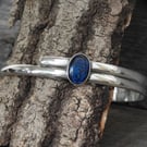 Sterling silver double-band armlet set with deep blue abalone