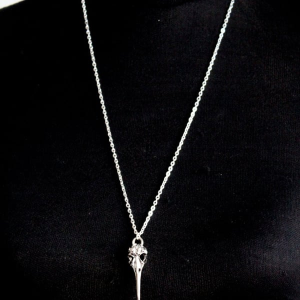 Long skeleton dagger necklace