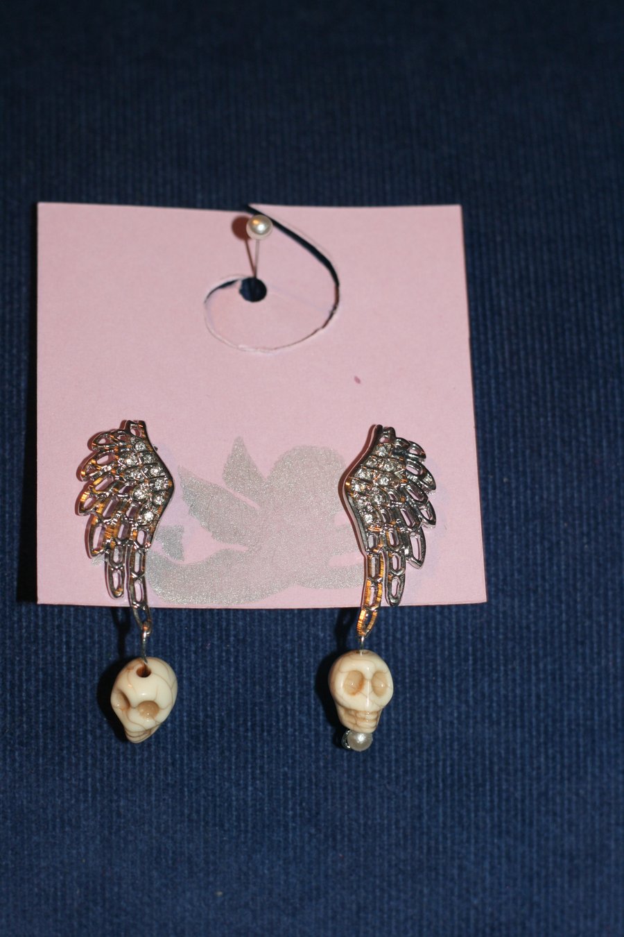 Wing and skull earrings