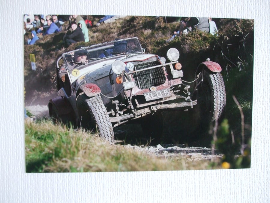 Photographic card of an Allard going up Blue Hills section on a Landsend Trial. 