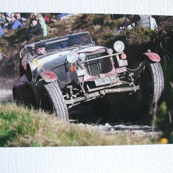 Photographic card of an Allard going up Blue Hills section on a Landsend Trial. 