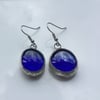 Royal blue, round, glass, drop style, vibrant and different earrings.