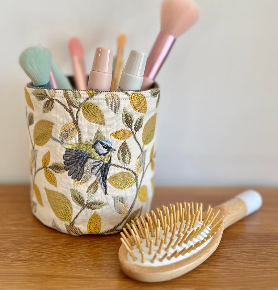 Textile storage pot with hand embroidered bluetit