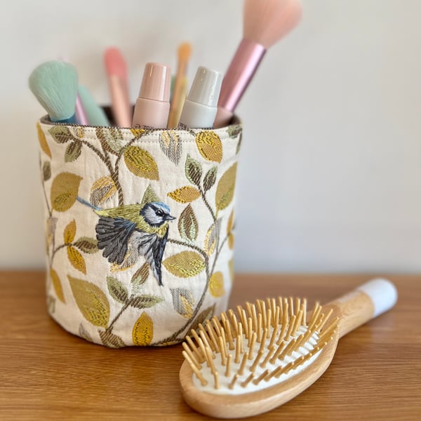 Textile storage pot with hand embroidered bluetit