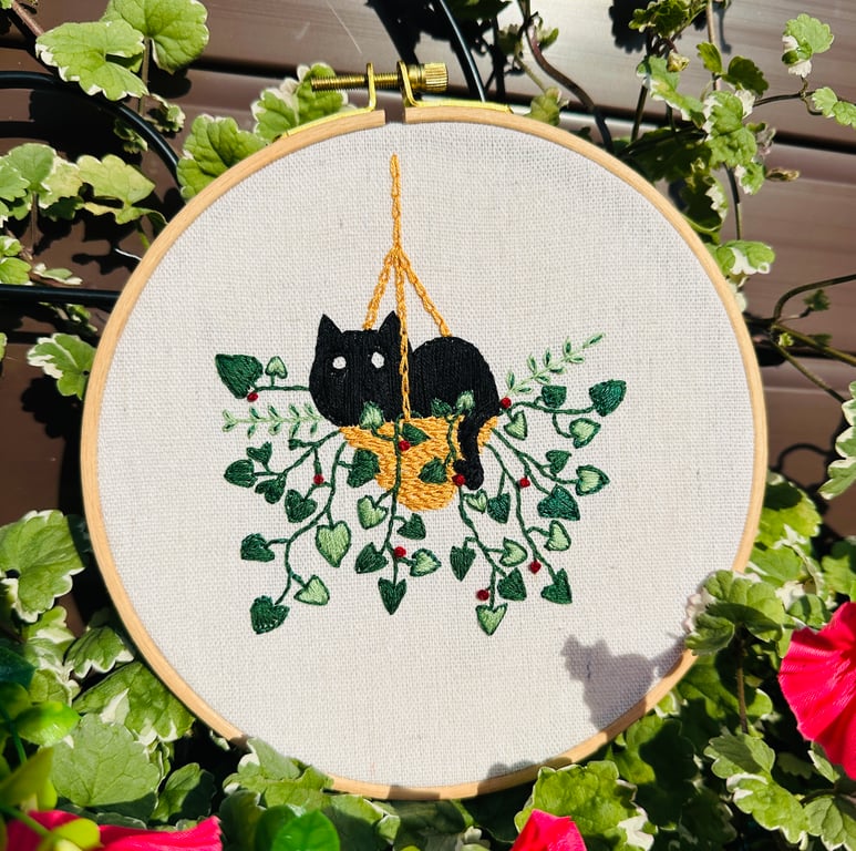 Black Cat in a hanging basket of plants, hand embroidered  decoration. 