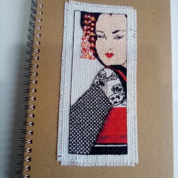 Beautiful hand stitched cross stitch A5 spiral bound ruled hard backed notebook.