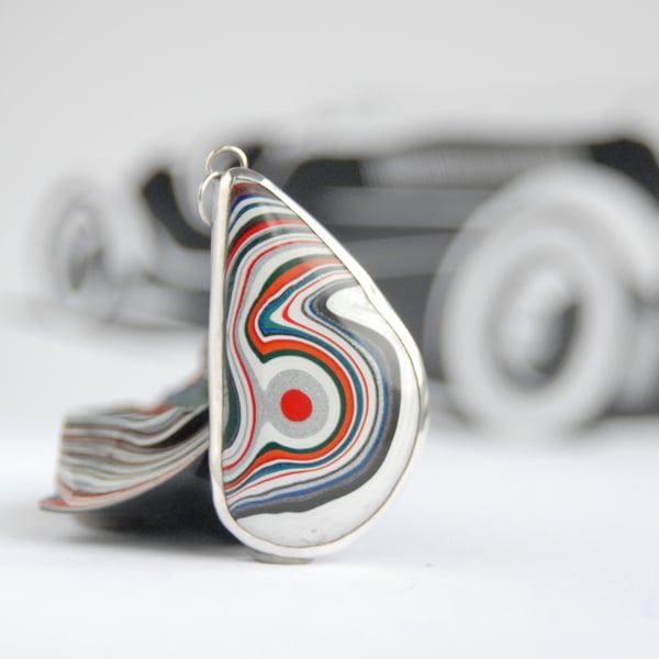 Kenworth fordite pendant (red eye)