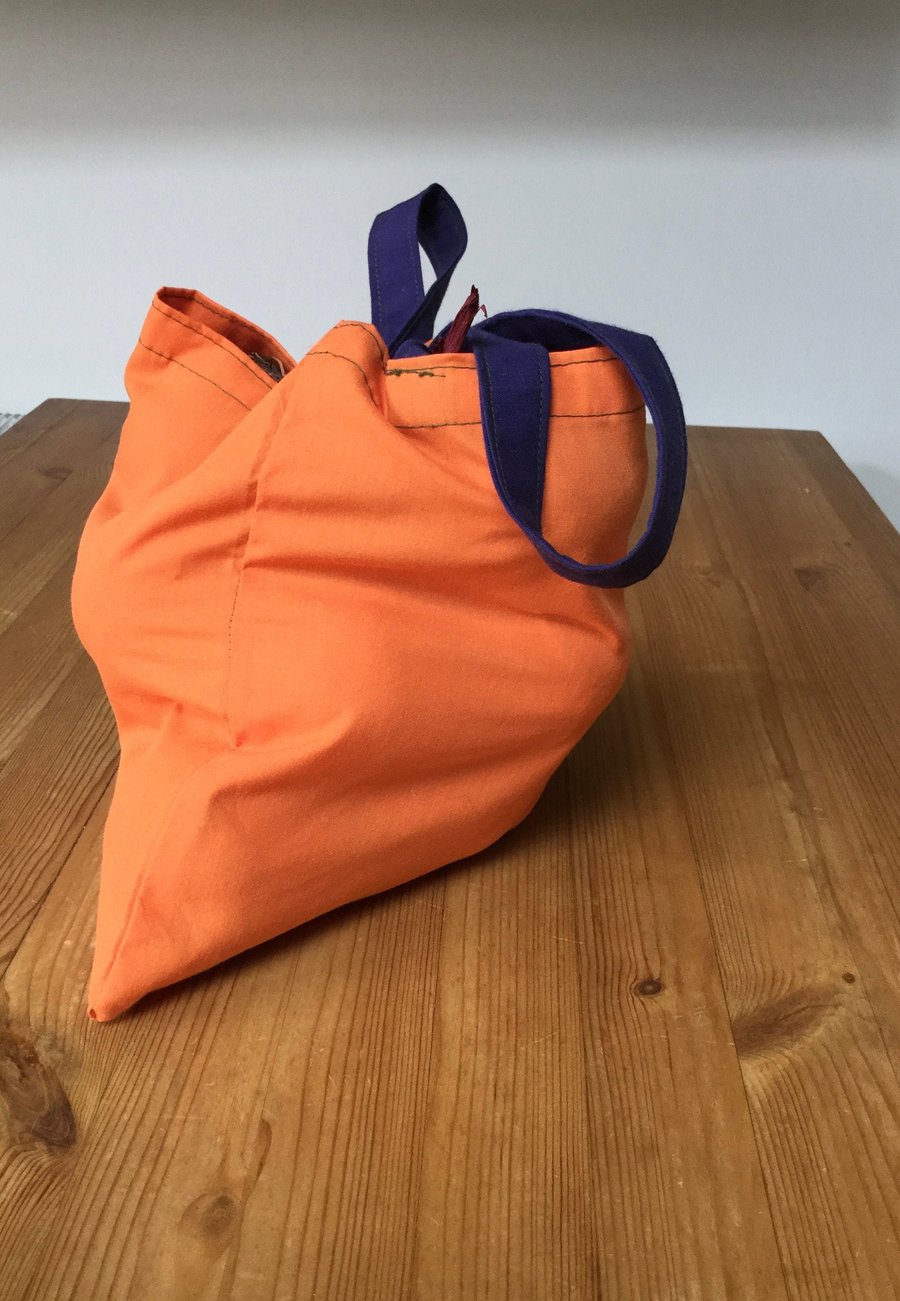 Coloured, reusable, recycled cotton fruit and vegetable shopping bags.