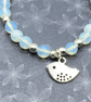Stretchy bracelet with opalite stones and silver plated bird charm - Image 2