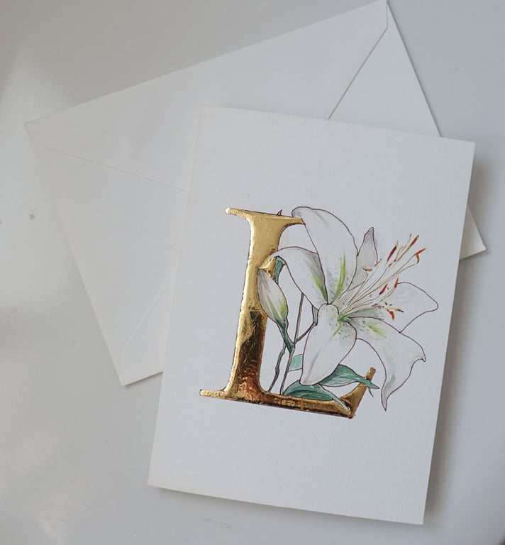 Watercolour hand painted card with single white lily gold leaf letter L