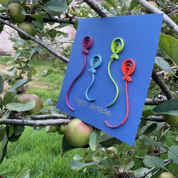 Four Quilled Balloons on a Blue Greetings Card