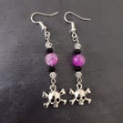 Beaded skull and crossbones charm dangle earrings 