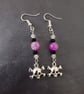 Beaded skull and crossbones charm dangle earrings 