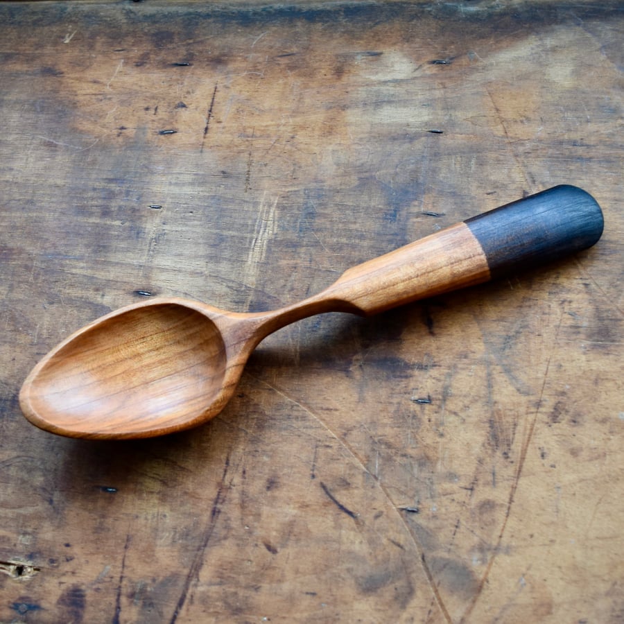 Hand carved wooden serving spoon with ebonised handle