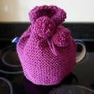 Hand knitted 2 pint (4 cup) tea cosy in Plum with matching Pom poms