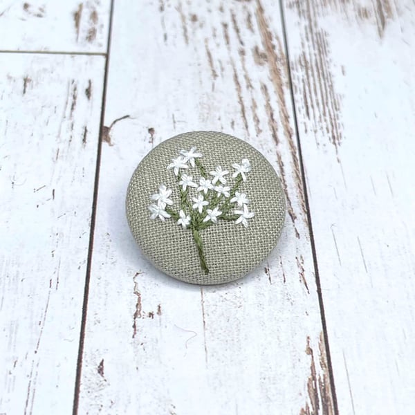 Hand embroidered brooch with white flower design. Zero waste jewellery gift