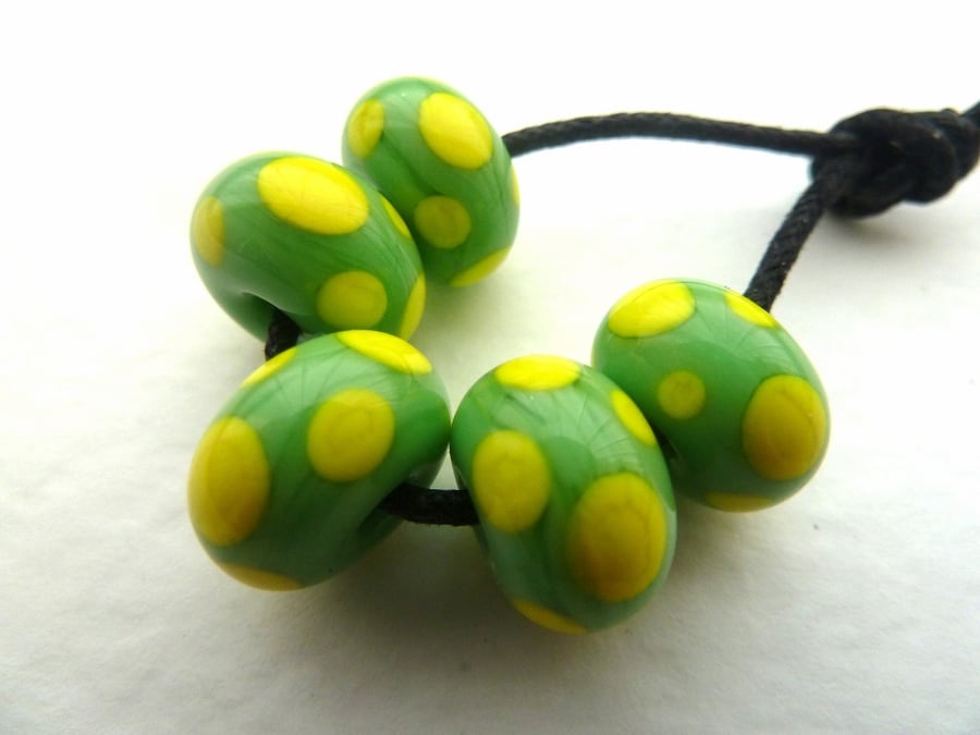 handmade lampwork glass beads, green and yellow spots