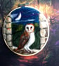 Needle felted owl in moonlit landscape 