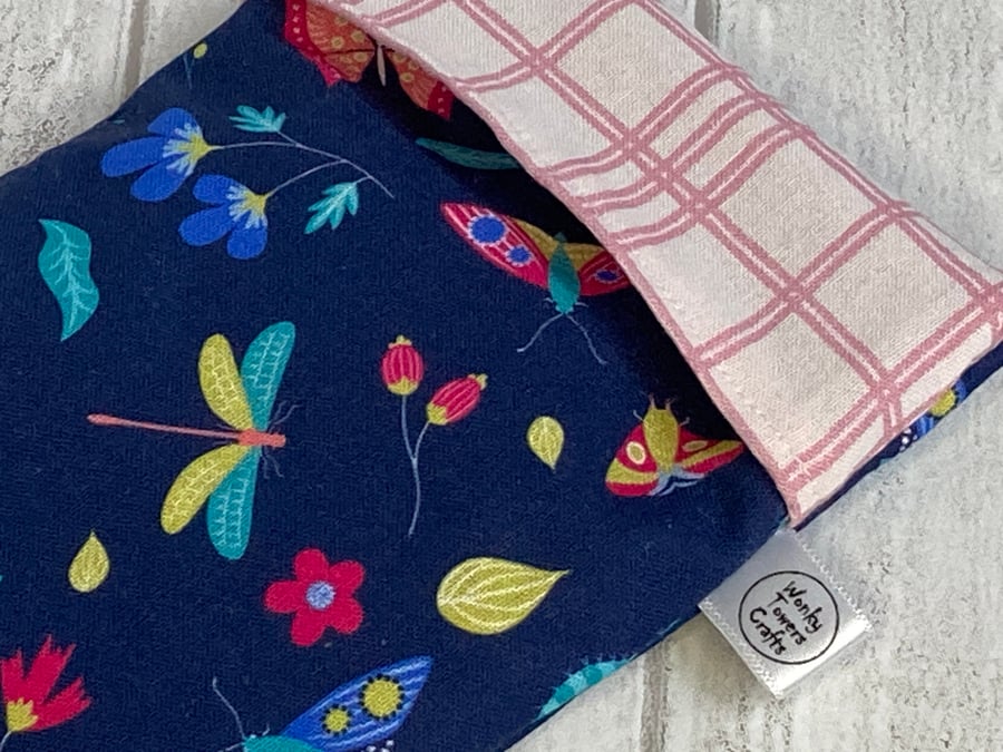 Reusable snack bag with food-safe lining. Navy flowers and insects.