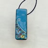  SLIM, TURQUOISE OBLONG FLORAL ENAMELLED PENDANT WITH STERLING SILVER DESIGN