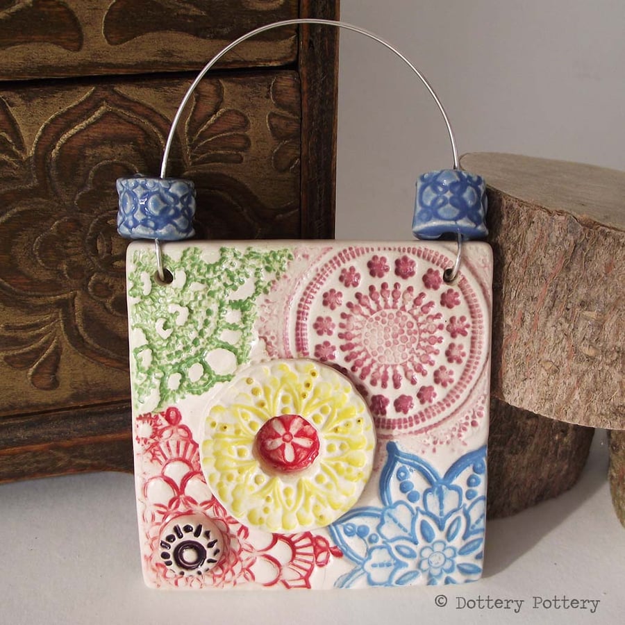 Small decorative ceramic tile with handmade beads patchwork design
