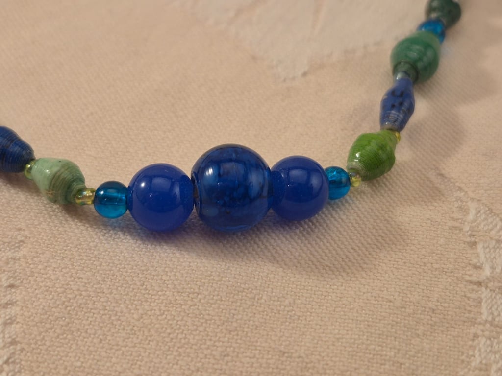 Multi-hued blue & green paper and glass beaded necklace with blue accent beads