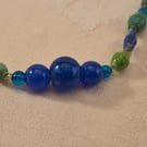 Blue & green paper and glass beaded necklace with blue accent beads