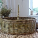 A Handmade Oval Willow Basket with a Catalan Style Base.