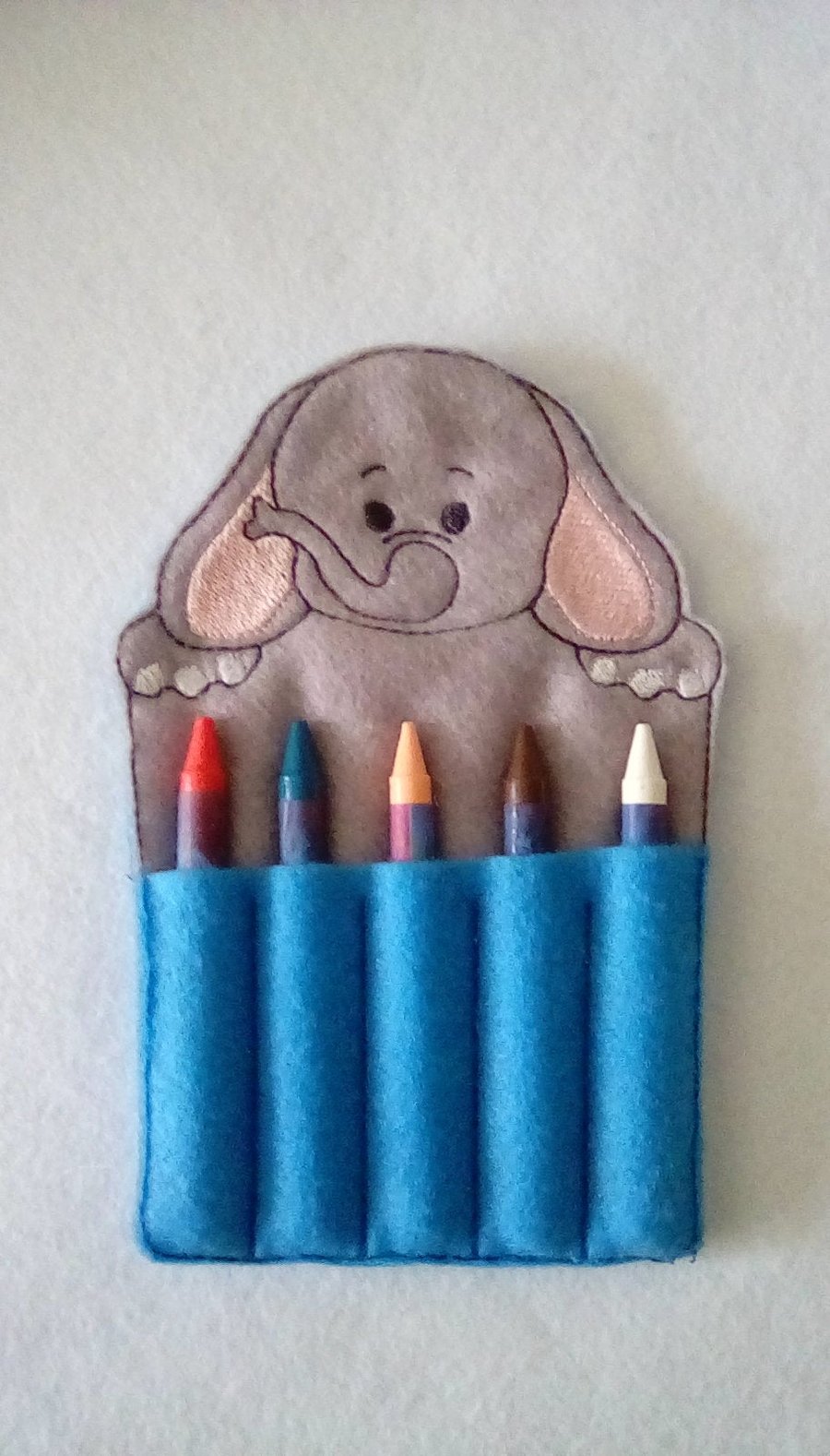 209. Elephant crayon holder.