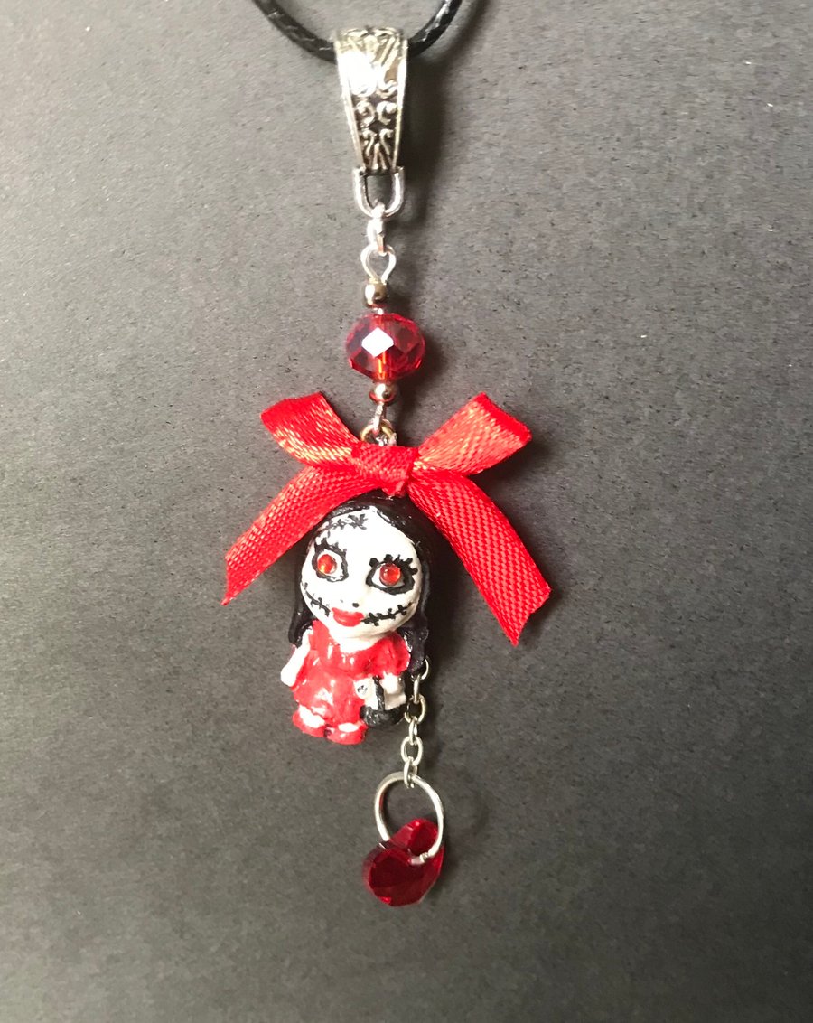 Broken doll necklace