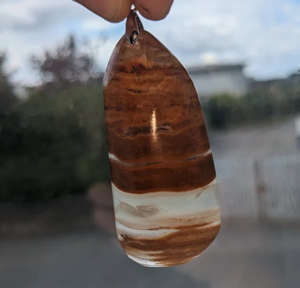 Hand-Polished Natural Mineral Pendant – Unique Banded Stone
