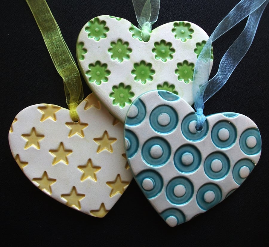 Set of three ceramic heart decorations