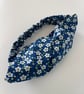 Cotton headband, twist knot style hairband in a blue and white floral print.