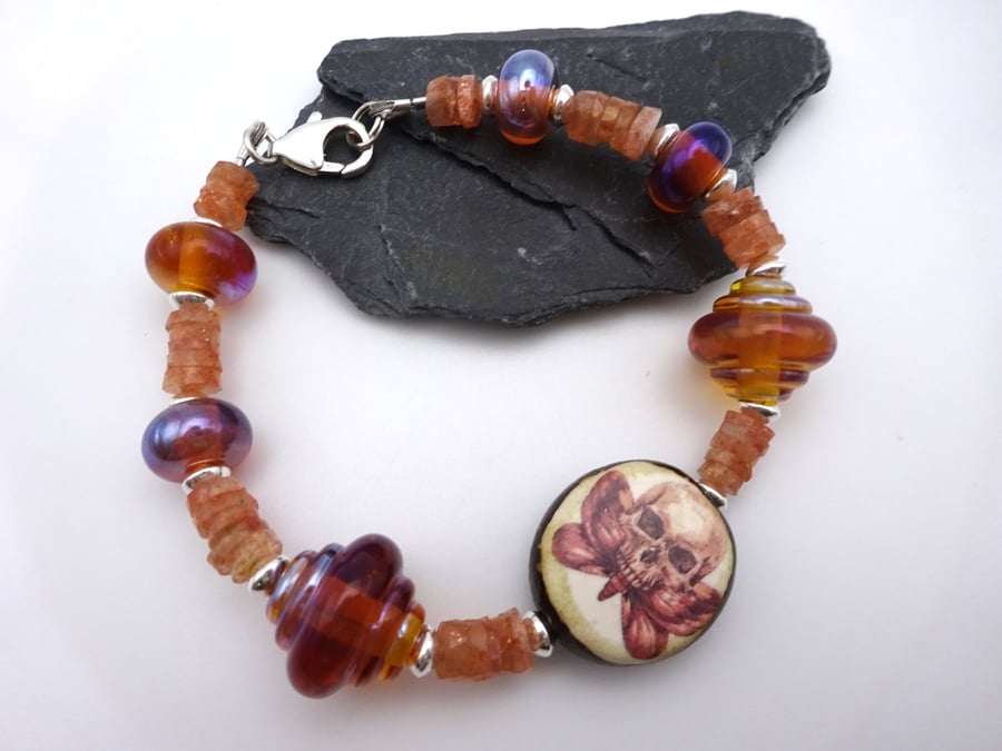 lampwork glass, ceramic moth skull and sunstone gemstone bracelet