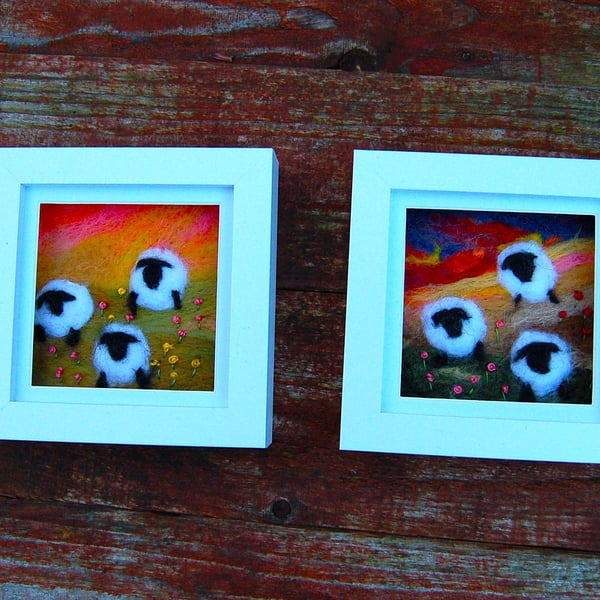 Colourful sheep wool painting.  Needlefelt picture of three sheep and flowers