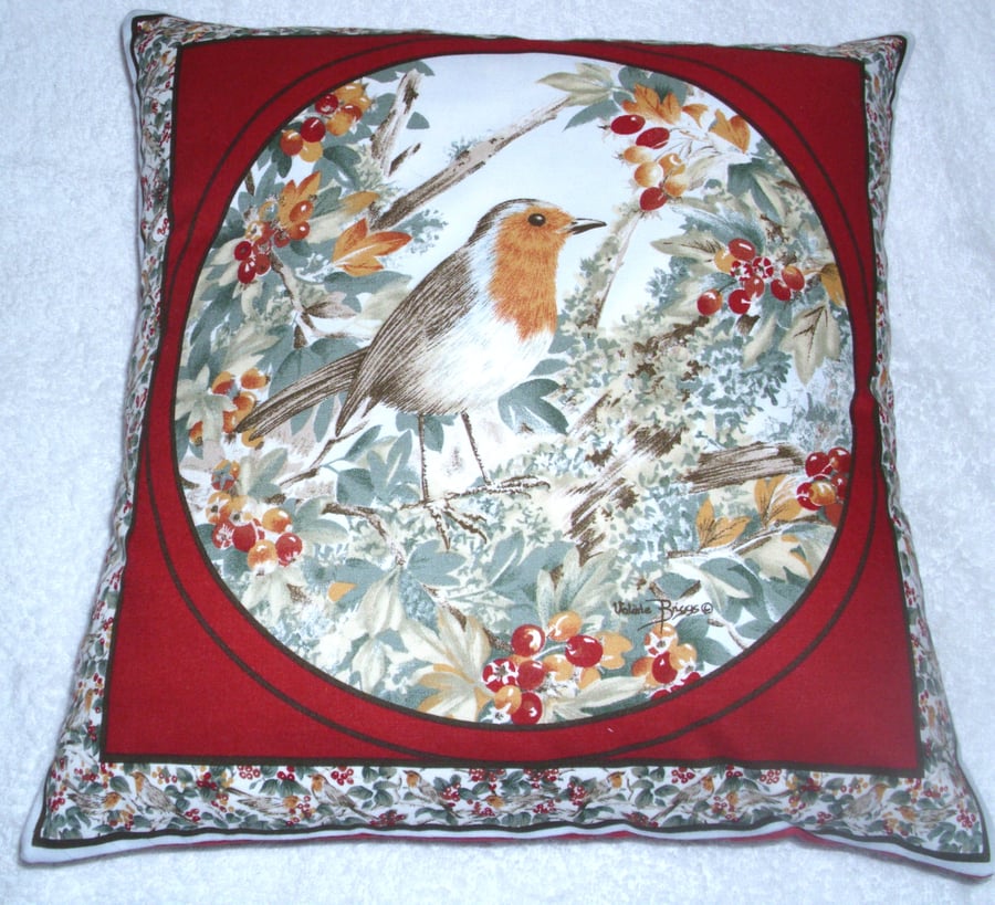 Pretty bright little Robin perched among Autumnal berries cushion