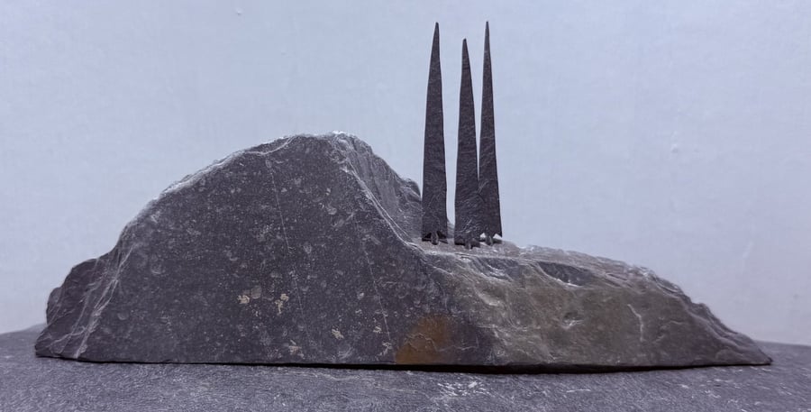 Three Tiny Tall Stone Trees on a Stone Hill