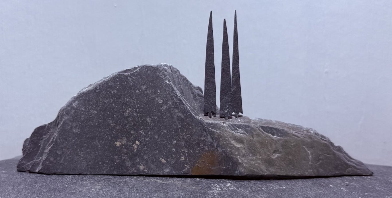 Three Tiny Tall Stone Trees on a Stone Hill