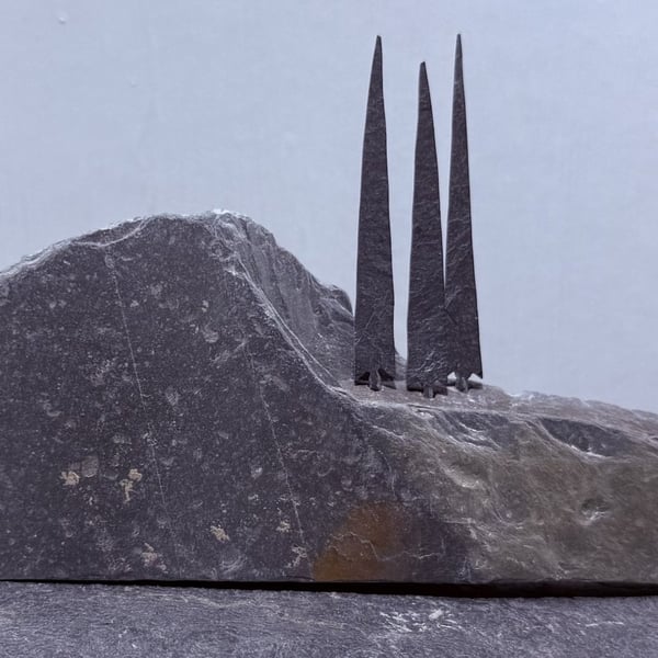 Three Tiny Tall Stone Trees on a Stone Hill