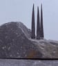 Three Tiny Tall Stone Trees on a Stone Hill