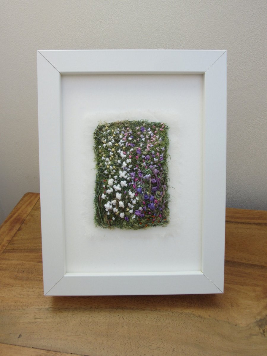 Summer garden embroidered picture.  Abstract flowers in white frame