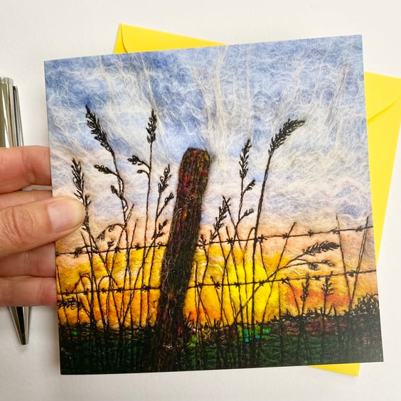 Sunrise morning through a fence printed card.