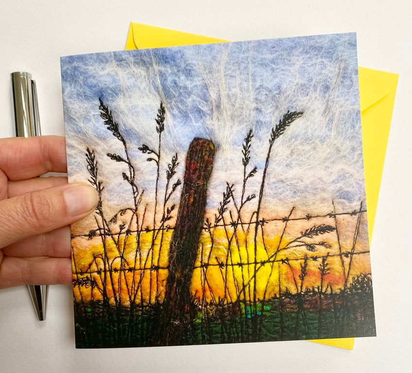 Sunrise morning through a fence printed card.